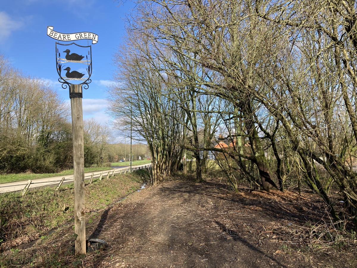 Vegetation clearance around Beare Green sign